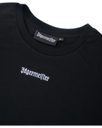 Cropped tee nero con logo Jägermeister.