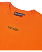 Cropped tee arancione con logo verde Jägermeister.