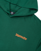 Felpa con cappuccio verde con logo Jägermeister arancione sul petto.