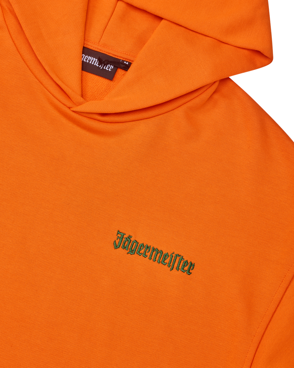 Felpa con cappuccio arancione con wordmark Jägermeister verde sul petto.