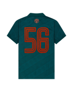 Maglia verde Jägermeister con un '56' arancione sul retro.