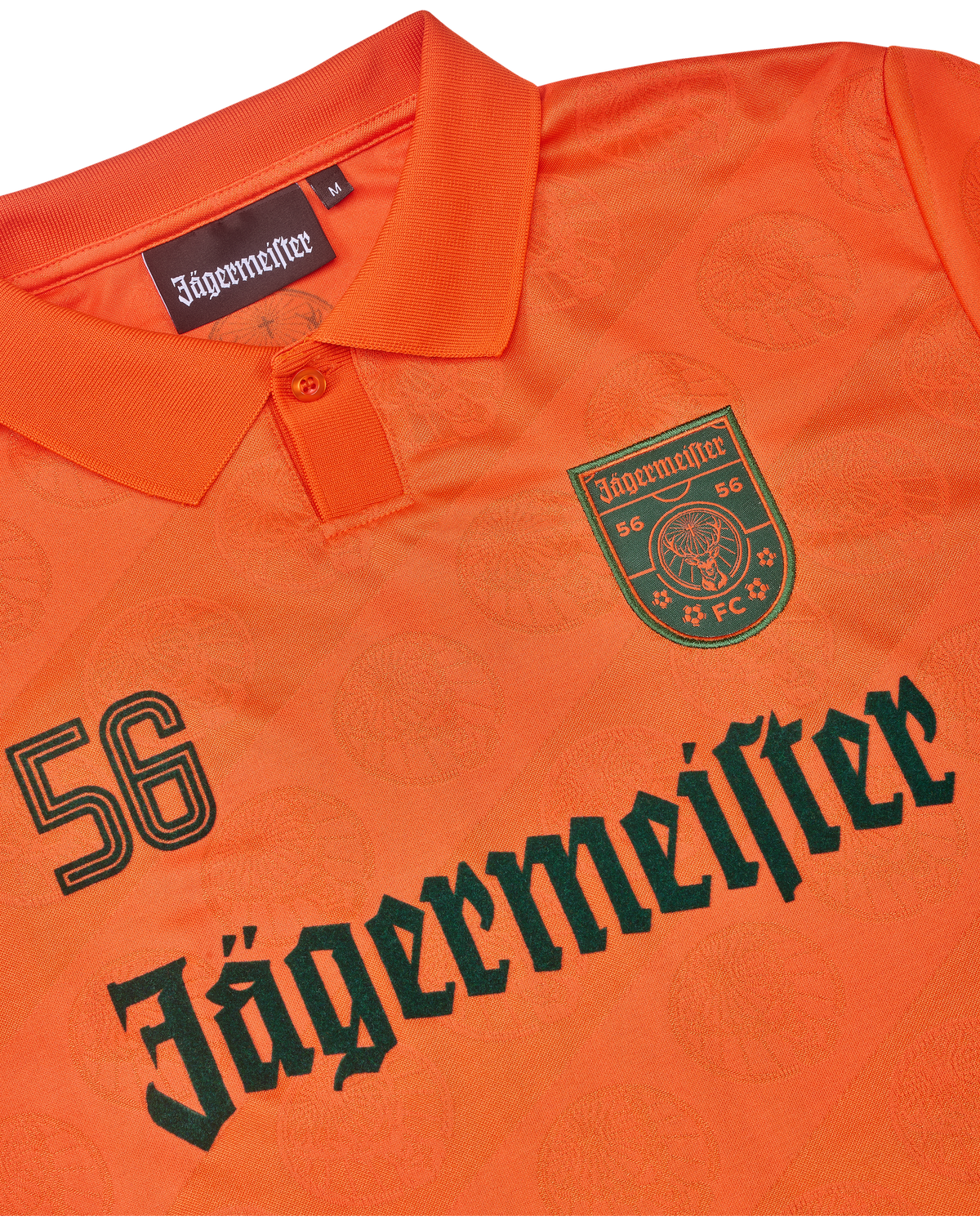 Jersey arancione con branding Jägermeister.