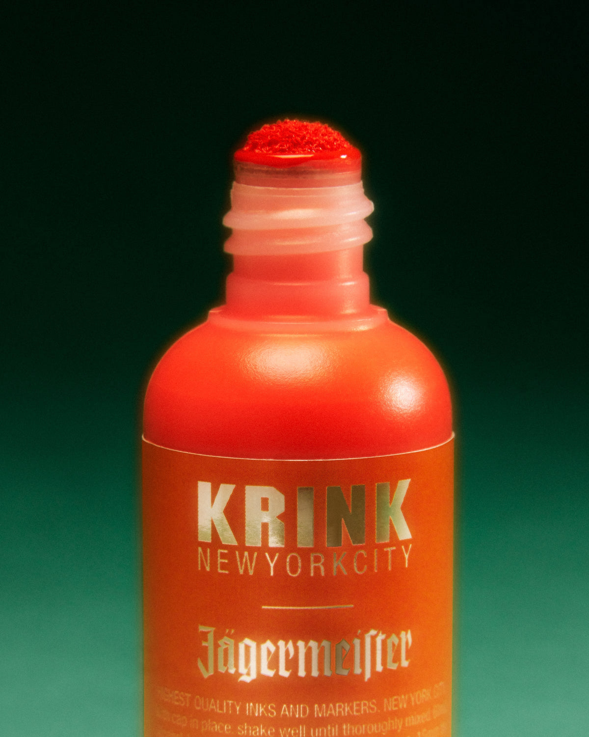 Orange Krink marker with Jägermeister branding on green background
