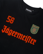 Maglia nera a maniche lunghe Jägermeister con branding e logo arancioni.