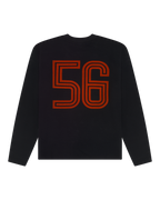 Maglia nera a maniche lunghe Jägermeister con numero 56 arancione.