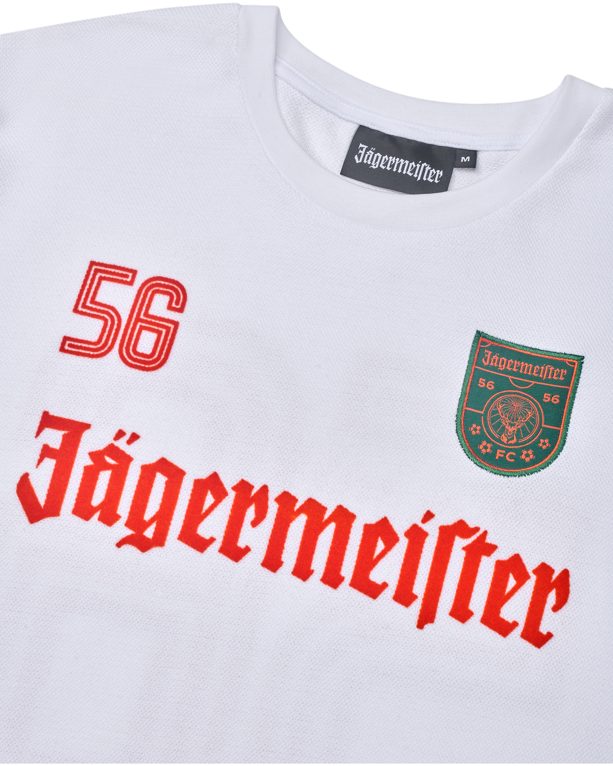 Maglia bianca a maniche lunghe con branding Jägermeister, inclusi numeri e logo.