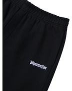 Pantaloni neri con logo bianco Jägermeister sul davanti.