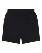 Pantaloncini neri Jägermeister visti da dietro senza alcun marchio visibile.
