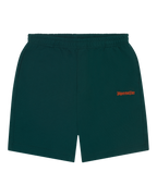 Pantaloncini verdi Jägermeister con branding arancione.