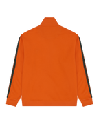 Giacca da tuta arancione con strisce verdi brandizzate sulle maniche.